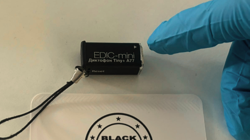 Technician performing a bug sweep for hidden listening devices in a Cyprus office