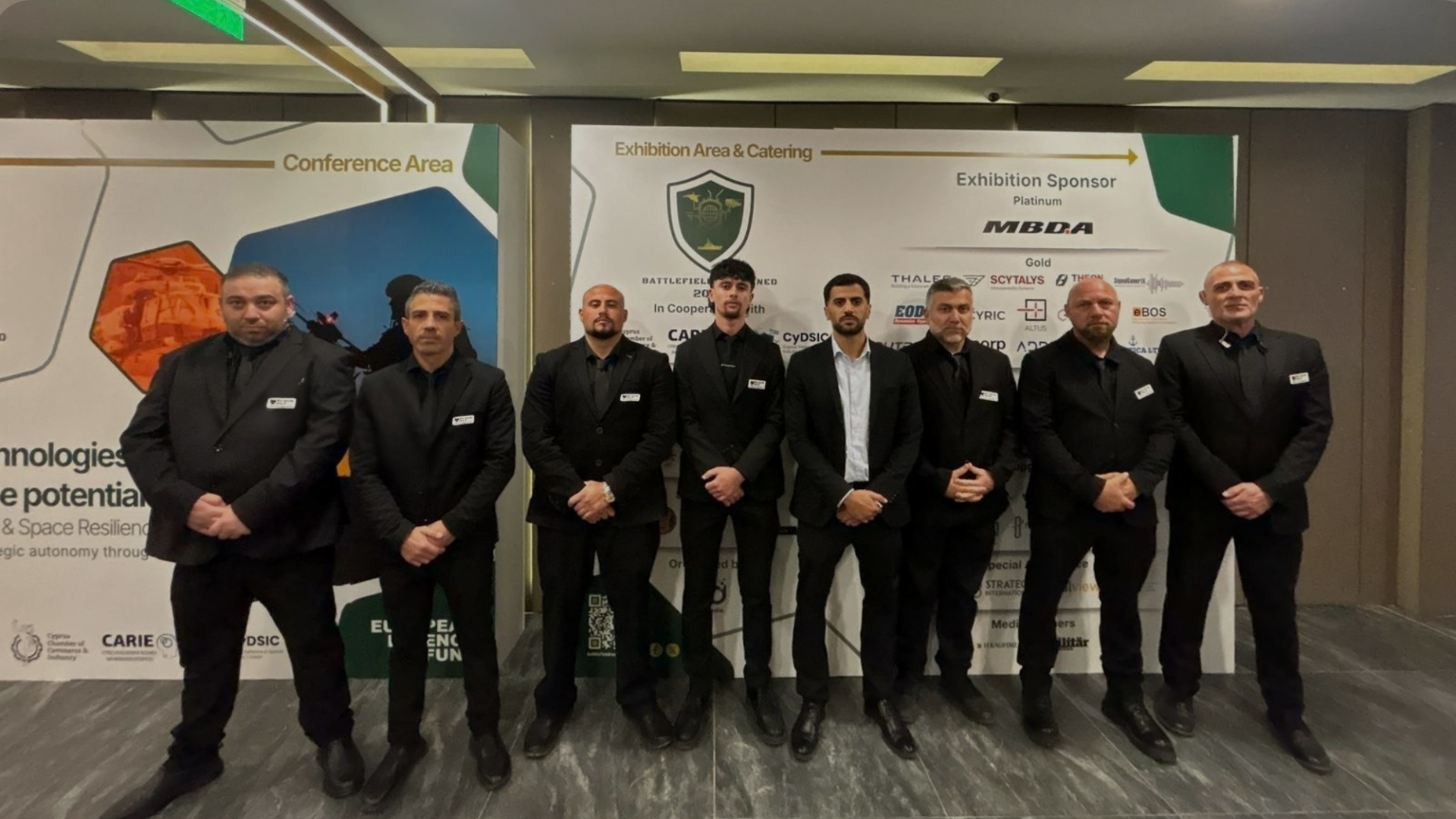 8 bodyguards standing in line, blackwolf private security